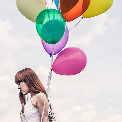 A woman with balloons.