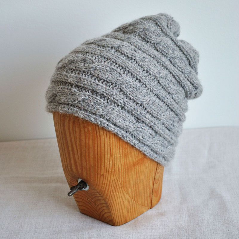Grey beanie made of wool and dog hair mix.