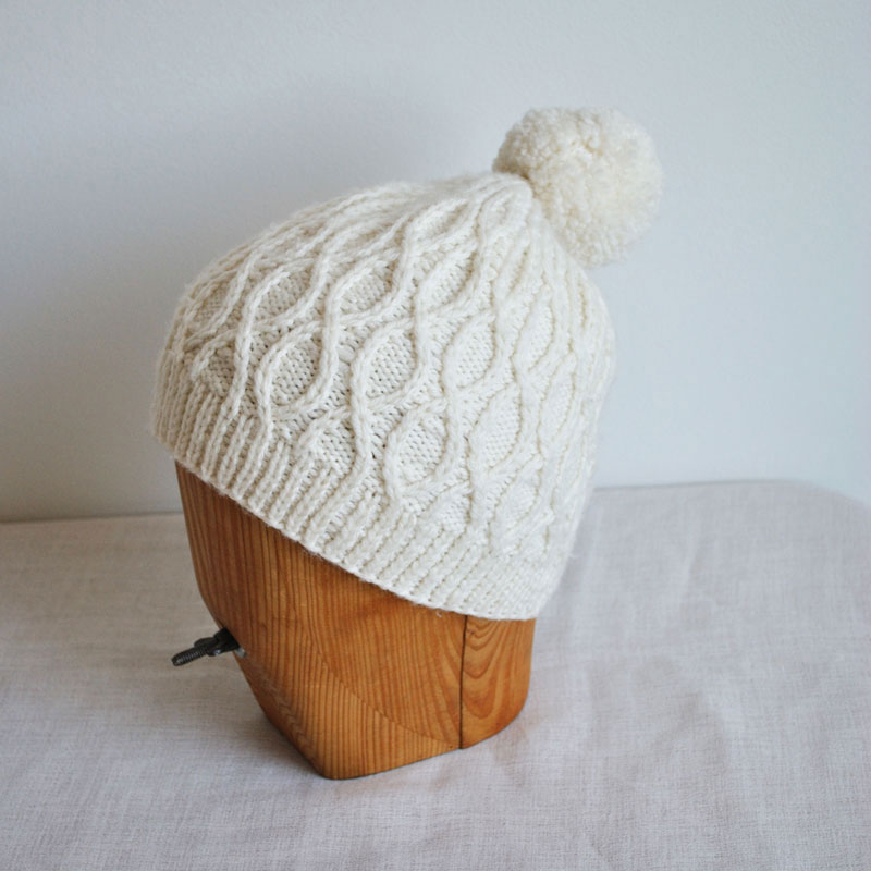 Woollen white beanie.